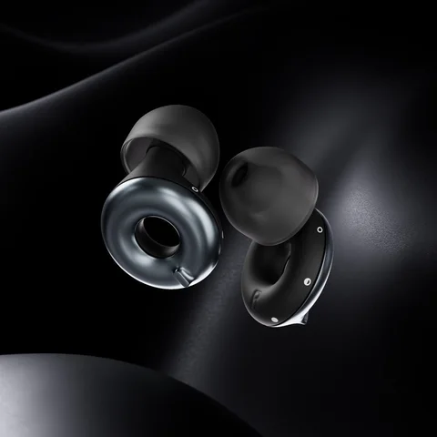 Black Loop Switch 2 earplugs against a dark sculpted surface.